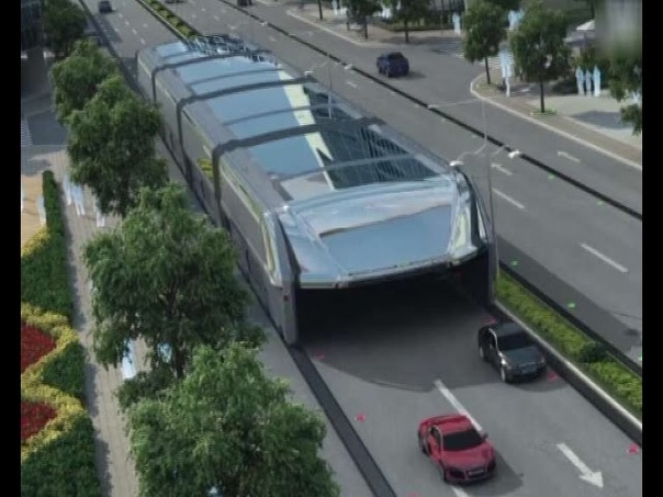 Futuristic straddling bus allows cars running