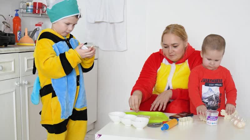 Mom and child prepare dinosaur shaped
