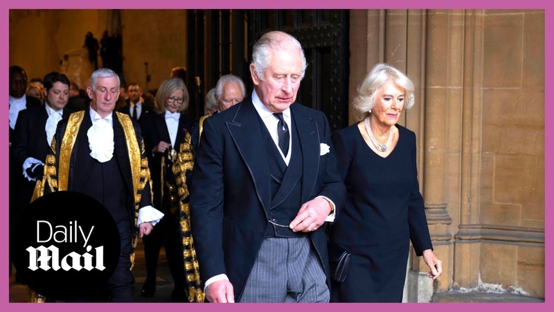 Grieving King Charles III being comforted by Queen Consort