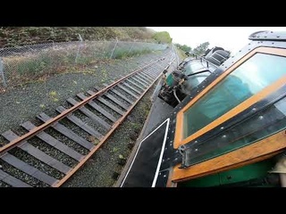 POV: Steam Locomotive Struggles to Pull Long Train on Wet Slippery Rails. LOTS of Wheel Slip!