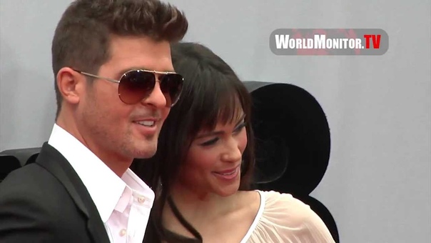 Robin Thicke and wife Paula Patton arrive at 2013 BET Awards Red