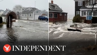 Floodwater carries debris down street amid Maine storm